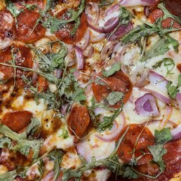 2 top spicy red sauce with pepperoni and raw onion. Topped with arugula and balsamic