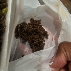 Black rice with HAIR intertwined in the food.