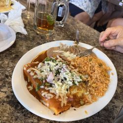 Los Magueyes Mexican Grill - Cheese and beef enchiladas with fresh chopped red onions on top