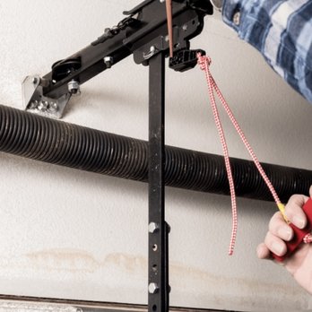 MS Garage Door Service - Springs: Lubricating to ensure smooth operation. - Garage Door Services Near Me MS Garage Door Service - Springs: Lubricating to ensure smooth operation. - Garage Door Services Near Me