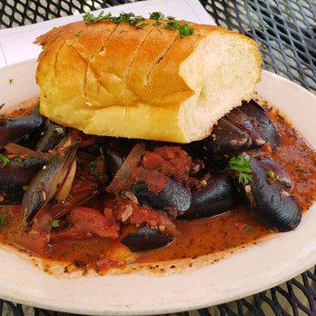 Europa Bar & Cafe - Fra Diavlo mussels with a baguette - Modern European Near Me - Greensboro, North Carolina Europa Bar & Cafe - Fra Diavlo mussels with a baguette - Modern European Near Me - Greensboro, North Carolina