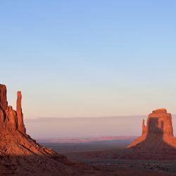 Navajo Spirit Tours - West Mitten Butte's shadow climbing up the side of East Mitten Butte
