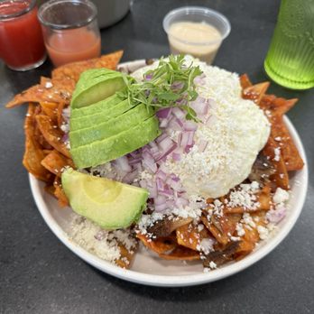 Heirloom Kitchen - Chilaquiles with crema on the side, add avocados.  Beyond delicious! - Burgers Near Me - Stockton, California