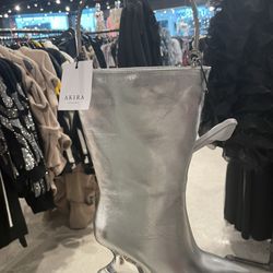 Akira - Looks like a boot. It's a purse complete with an inside pocket and zippers.