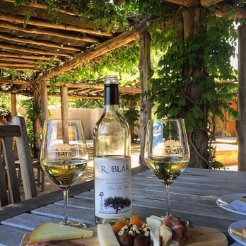 Roblar Winery - Relaxing in the lovely shaded pergola with bottle of Sauvignon Blanc is so refreshing on a hot day. - Wineries Near Me - Santa Ynez, California Roblar Winery - Relaxing in the lovely shaded pergola with bottle of Sauvignon Blanc is so refreshing on a hot day. - Wineries Near Me - Santa Ynez, California