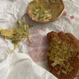 A chicken sandwich with mustard, lettuce, and onion. It was supposed to be the Double Fry Lover's Burger with ONLY mustard. A chicken sandwich with mustard, lettuce, and onion. It was supposed to be the Double Fry Lover's Burger with ONLY mustard.