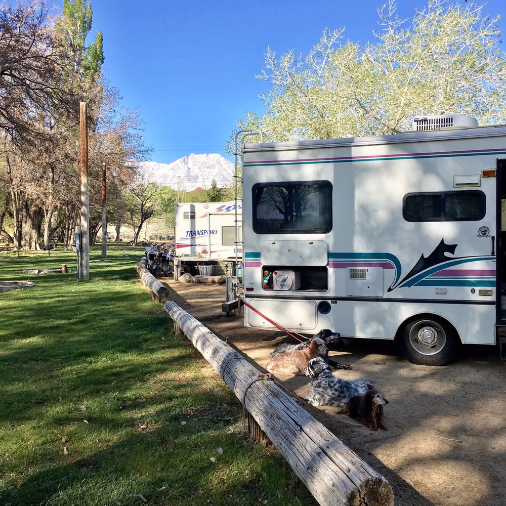 Brown's Town Campground - a white rv parked next to a log - Campgrounds Near Me - Bishop, California Brown's Town Campground - a white rv parked next to a log - Campgrounds Near Me - Bishop, California