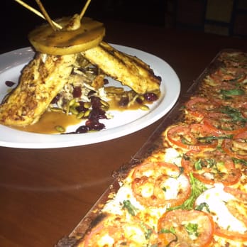 Seasons 52 - Ripe tomato flatbread and cider glazed chicken skewers appetizers - New American Near Me - Costa Mesa, California