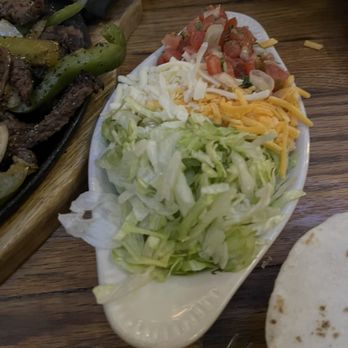 Trini's - Toppings for the fajitas - Mexican Near Me - Omaha, Nebraska Trini's - Toppings for the fajitas - Mexican Near Me - Omaha, Nebraska