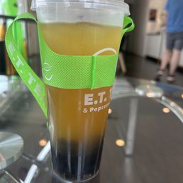 Green tea with boba, light ice