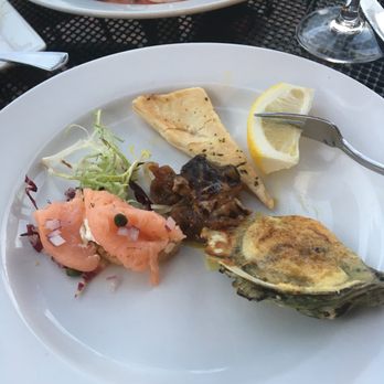 Capriccio - Shared starters of smoked salmon, seared foie gras, and oysters Rockefeller - New American Near Me - Providence, Rhode Island