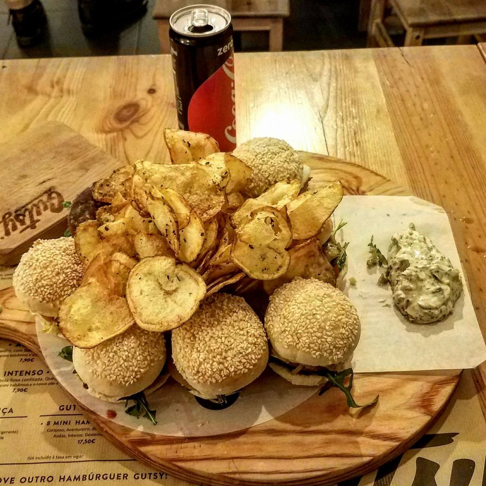 Gutsy - "I will gladly pay you tuesday for a hambúrguer today." I call this The Wimpy Special. 8 of Gutsy's mini burgers, each a different flavor. - Burgers Near Me - Lisbon, 11 Gutsy - "I will gladly pay you tuesday for a hambúrguer today." I call this The Wimpy Special. 8 of Gutsy's mini burgers, each a different flavor. - Burgers Near Me - Lisbon, 11