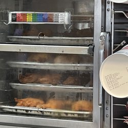 KFC - This is the station holding the 6 new trays of chicken I watched the young employee put in the cabinet