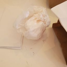 The remnants of my Turkey Egg and Cheese Sandwich on Plain Bagel