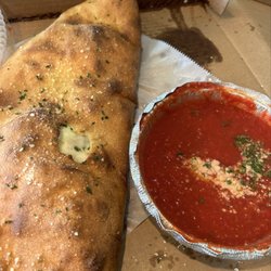 Cap's Pizza - Lg calzone and plenty of sauce!!! That's a win most places lack an enough sauce!