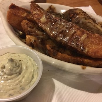 The Black Raven - Guinness Chips, Irish chips (potato wedges) covered in Guinness Cheddar - Irish Pub Near Me - Harrah, Oklahoma The Black Raven - Guinness Chips, Irish chips (potato wedges) covered in Guinness Cheddar - Irish Pub Near Me - Harrah, Oklahoma
