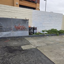 Graffiti and trash at the back of the property.
