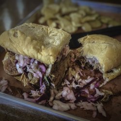 The Que Abides - The Treehorn - Cajun sausage & pulled pork with NC style coleslaw.