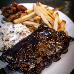 Baby Back Ribs & Wings
Fall-off-the-bone slow-cooked Baby back Pork Ribs in our signature BBQ sauce. Served with fries and our house slaw.