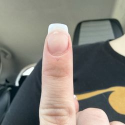 Glitzy Nail & Hair Lounge - Nail is crooked.