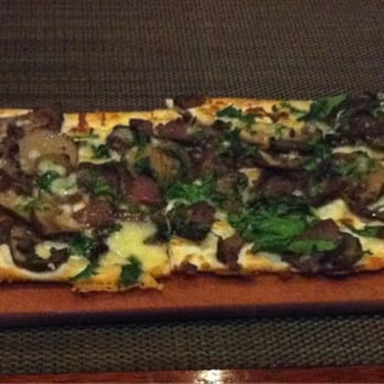 Seasons 52 - Flatbread - steak & cremini mushroom, fresh spinach & crumbled bleu cheese.  http://Facebook.com/GoodEatsStacy - New American Near Me - Costa Mesa, California