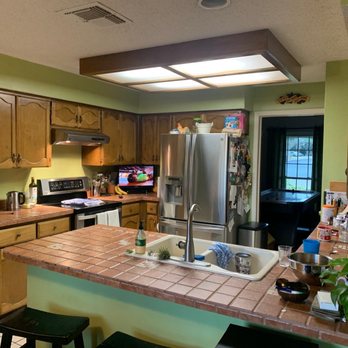 SA Flooring Perfections - a kitchen with a sink, stove, and refrigerator - Flooring Near Me - San Antonio, Texas