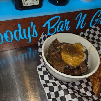 Woody's Bar & Grill - Beef Tip served on a bed of homemade mashed potatoes and homemade gravy - Sports Bars Near Me - Miami, Oklahoma Woody's Bar & Grill - Beef Tip served on a bed of homemade mashed potatoes and homemade gravy - Sports Bars Near Me - Miami, Oklahoma