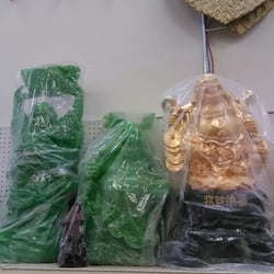 Buddha sculptures, Elephant and frog figurines. Asian inspired decorations.