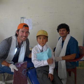 Three Rivers Dental - Dr. Roach with translator Abraham and a Tibetan school boy after receiving ceremonial scarf in Tibet, 2015 - General Dentistry Near Me - Kennewick, Washington Three Rivers Dental - Dr. Roach with translator Abraham and a Tibetan school boy after receiving ceremonial scarf in Tibet, 2015 - General Dentistry Near Me - Kennewick, Washington