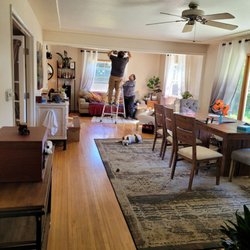 A-Z Home Services - Al and Carmen working in my livingroom with my pups supervising.