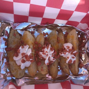 Phenix Wings - a tray of baked potatoes and bacon - Chicken Wings Near Me - Phenix City, Alabama Phenix Wings - a tray of baked potatoes and bacon - Chicken Wings Near Me - Phenix City, Alabama