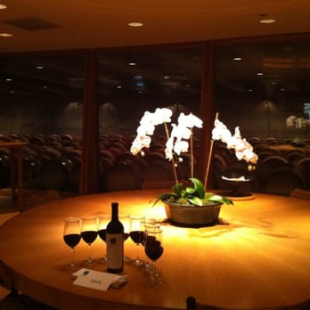 Opus One Winery - In an Elegant tasting room overlooking the cask filled cave, your Opus One 2010 $235 per bottle awaits at the end of the tour. - Wineries Near Me - Oakville, California Opus One Winery - In an Elegant tasting room overlooking the cask filled cave, your Opus One 2010 $235 per bottle awaits at the end of the tour. - Wineries Near Me - Oakville, California