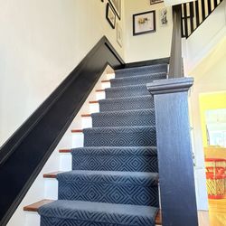 Harry's Carpets Inc - Blue stair runner on wooden stairs with black bannister