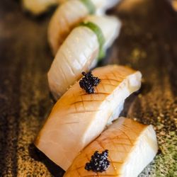 Ken Sushi & Asian Bistro - Rear: Suzuki, Japanese sea bass,imported. . Front: Swordfish belly.