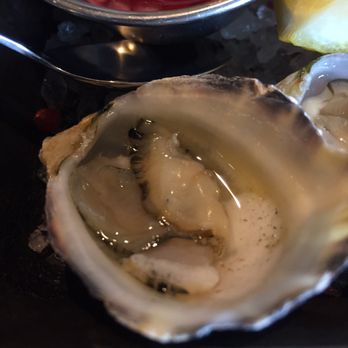 Six Seven Restaurant - Oyster close-up - New American Near Me - Seattle, Washington Six Seven Restaurant - Oyster close-up - New American Near Me - Seattle, Washington