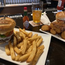 Sanford Brewing Company - Maitland - The Maitland Burger with fries and the Mahi Sandwich with pretzel bites