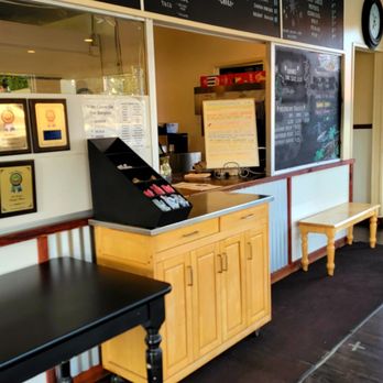 Yeong's Place - a restaurant counter with a menu on the wall - Burgers Near Me - North Bend, Oregon