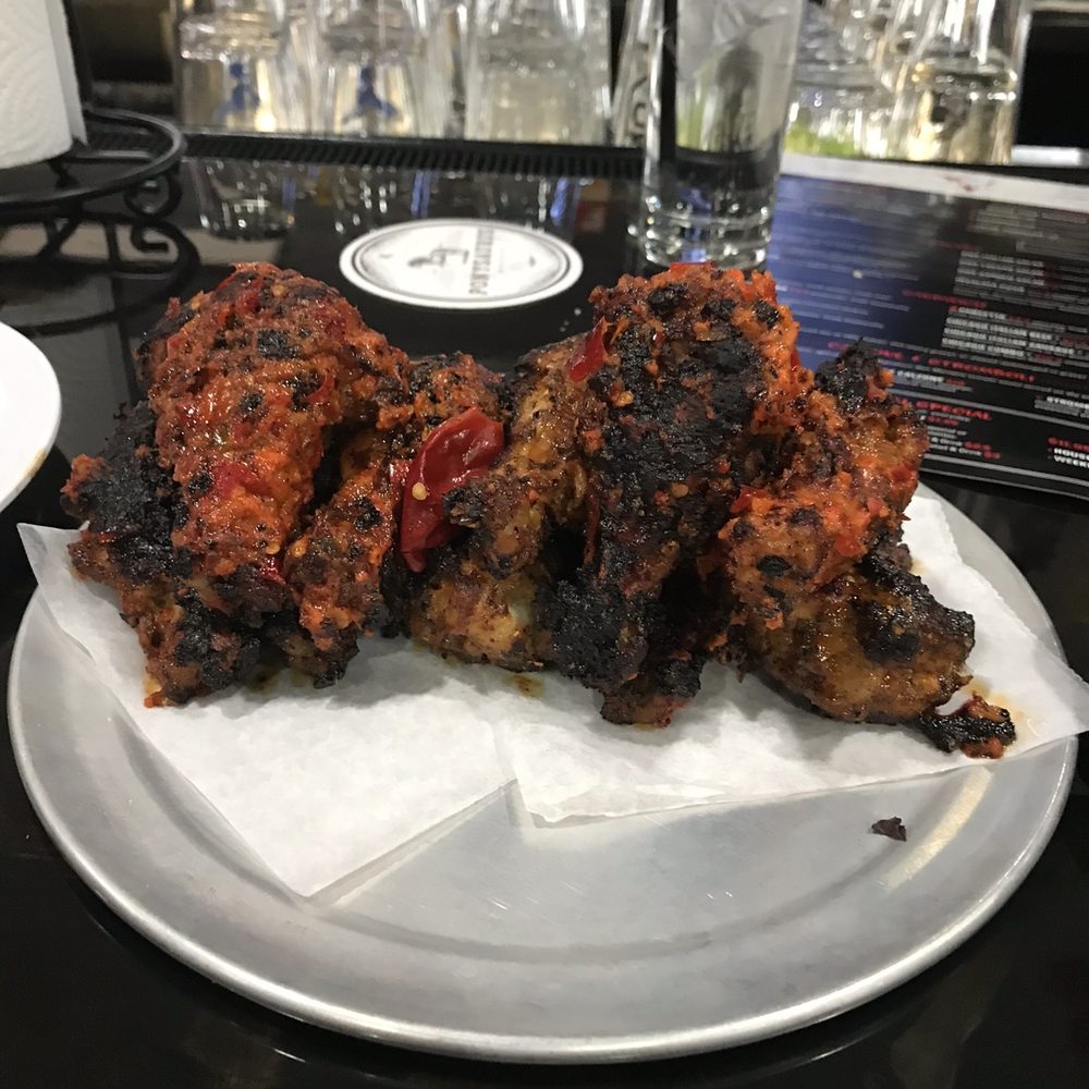 V Pizza - Seen here are the Calabrian wings, which are oven roasted like all of V's wings. - Pizza Near Me - Cary, North Carolina V Pizza - Seen here are the Calabrian wings, which are oven roasted like all of V's wings. - Pizza Near Me - Cary, North Carolina