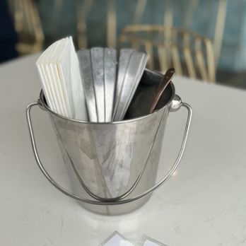 Bites & Bashes Cafe - Utensils are in a bucket on the table - Cafes Near Me - Lomita, California Bites & Bashes Cafe - Utensils are in a bucket on the table - Cafes Near Me - Lomita, California