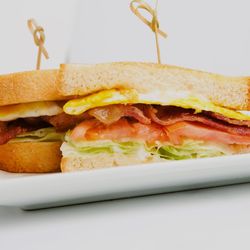 Cracked & Crepe - "BLTE Sandwich: A delightful twist on a classic BLT, featuring the perfect crunch of lettuce, savory bacon, fresh tomato, and a kick of egg!