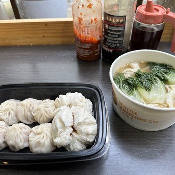 Seattle Dumpling - Left: Pork Xiao Long Bao Middle: Steamed BBQ Pork Bun Right: Wheat Noodle Soup - Chinese Near Me - Seattle, Washington