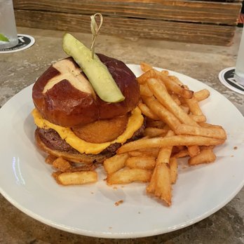 The Post At Lamar Park - One of there new burgers with an onion ring on it - Gastropubs Near Me - Corpus Christi, Texas The Post At Lamar Park - One of there new burgers with an onion ring on it - Gastropubs Near Me - Corpus Christi, Texas