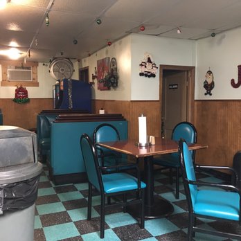 Art's Varsity Pizza - a dining room with blue chairs and a black and white checkered floor - Pizza Near Me - Anderson, Indiana Art's Varsity Pizza - a dining room with blue chairs and a black and white checkered floor - Pizza Near Me - Anderson, Indiana