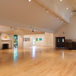 Unitarian Society of Ridgewood - Anderson Auditorium is a beautiful, spacious room with several stained glass windows, vaulted ceiling and AV equipment.