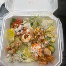 a salad in a styrofoam container a salad in a styrofoam container