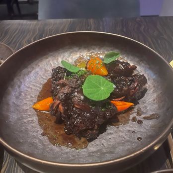 Dōgon - Braised Oxtail - Caribbean Near Me - Washington, DC, District of Columbia