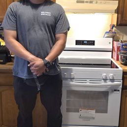 Gregory after installing the new Stove. Gregory after installing the new Stove.