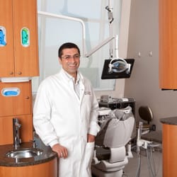 Infinite Dental Wellness - Dr. Leon in a patient exam room.