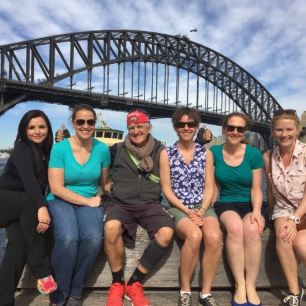 Bike Buffs - Graeme with the ladies in the group in front of the Sydney Bridge. - Tours Near Me - Millers Point, NSW