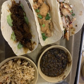 The Taco Stache - Left to right:: The Rich Uncle, the Cowboy, and the Swashbuckler. Then there's black beans and mixed rice. - Mexican Near Me - Pooler, Georgia The Taco Stache - Left to right:: The Rich Uncle, the Cowboy, and the Swashbuckler. Then there's black beans and mixed rice. - Mexican Near Me - Pooler, Georgia
